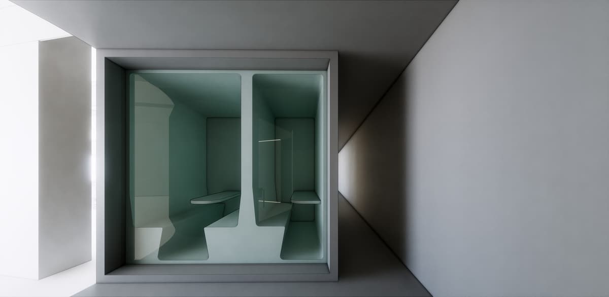 Frontal rendering of a two-seat glazed phone booth with pale green interior set into a grey wall